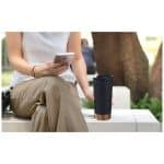 Hand,Of,A,Woman,Grabbing,Reusable,Coffee,Cup,,Tumbler,While